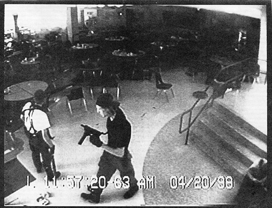 Surveillance video of Eric Harris, left, and Dylan Klebold in the Columbine High School cafeteria during the shooting. Dec. 16, 1999 Littleton, Colo (SHNS photo courtesy The Denver Rocky Mountain News)