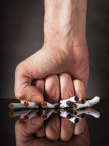 Fist smashing cigarettes