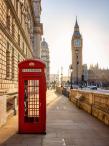 a London telephone booth with the Big Ben clock in the background
