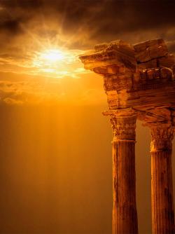 Ruins of a Greek temple in sunset
