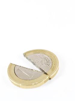 Broken Euro coin on white background