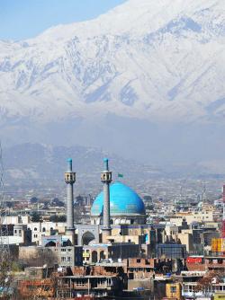Kabul with mountains in the background and blue dome mosque