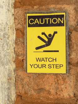 Watch your step sign slipping towards Sodom
