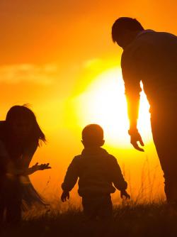 Family at sunset nuclear family concept