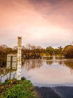 Australia flooding meter marker at sunset