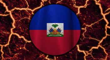 circular representation of Haitian flag against a fiery and cracked background as if it were lava