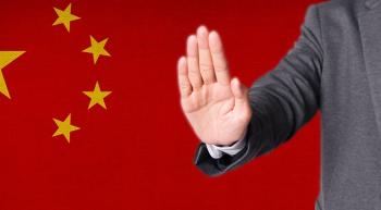 chinese flag with a man holding out hand in rejection