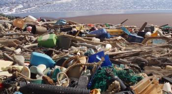 a beach strewn with plastic garbage