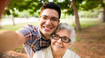 man taking a selfie with "grandma"