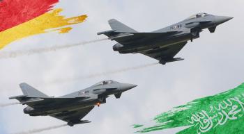 fighter jets flying with German and Saudi flags in the sky