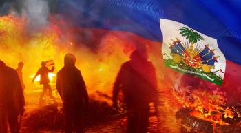 rioters burning cars and a flag of Haiti overlaying the upper right corner