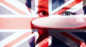 child holding up empty bowl with British flag