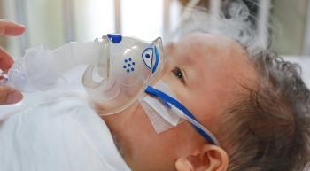 infant with an oxygen mask