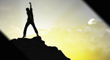 man standing on a mountain top