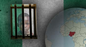 nigerian flag in background with globe showing location of Nigeria and a child peering through a barred window