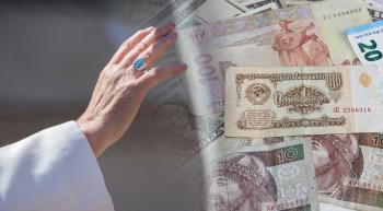 popes hand stretched towards different types of currency