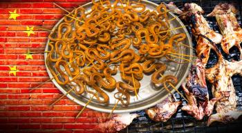 Chinese flag with a platter of snakes and rats on a grill