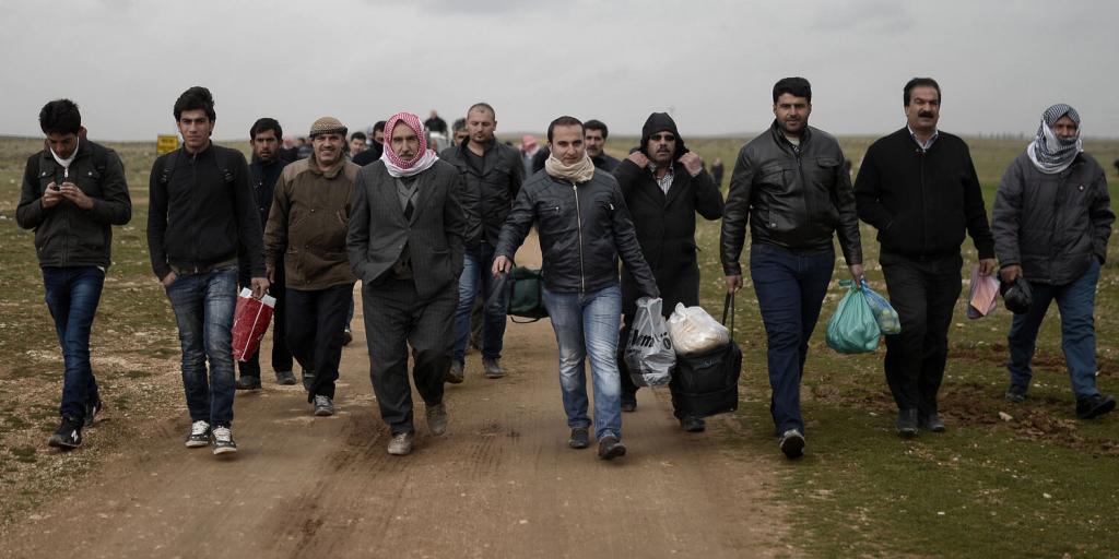 a group of Syrian refugees entering Europe