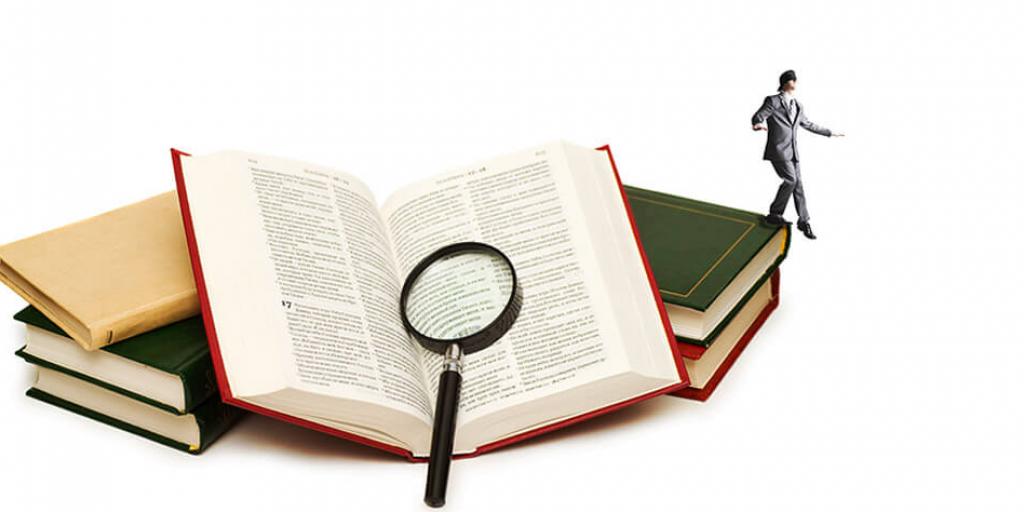 A tiny blindfolded man walking off of a stack of books, one of which is an open Bible with a magnifying glass resting on it