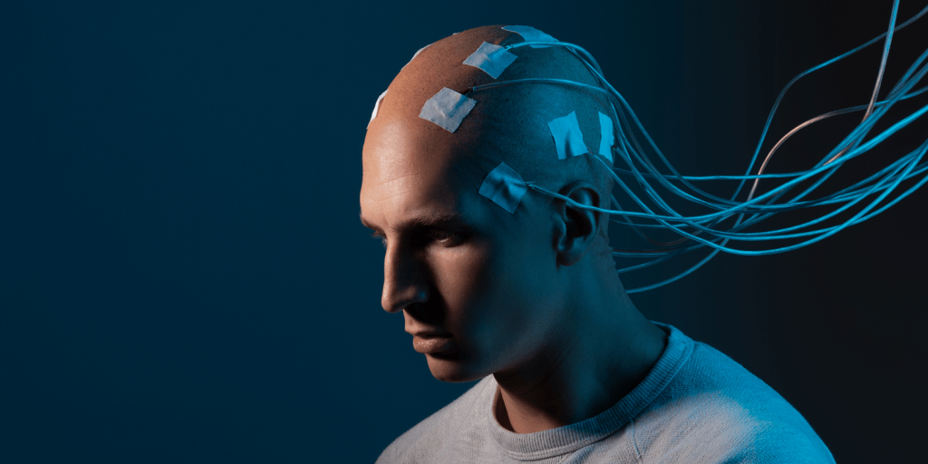 man with electrodes attached to his head