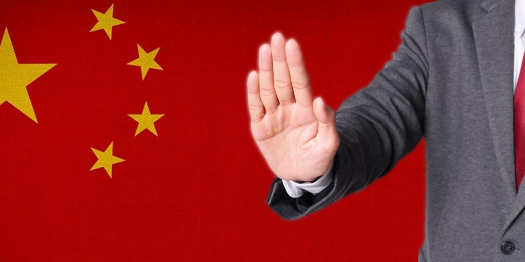 chinese flag with a man holding out hand in rejection