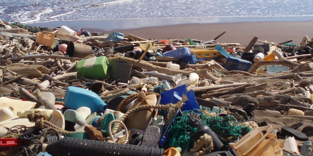 a beach strewn with plastic garbage