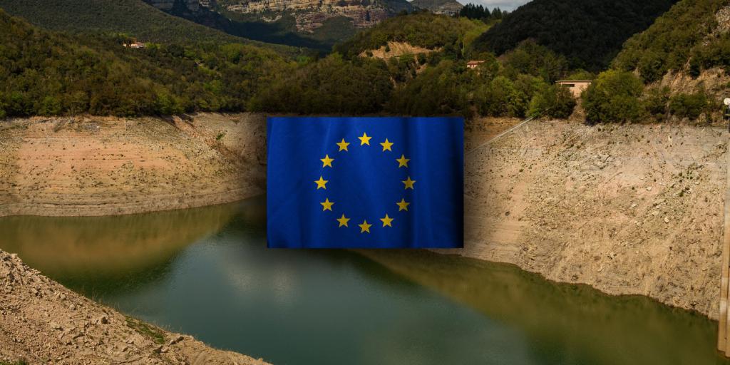 Almost empty Spanish reservior with EU flag in center