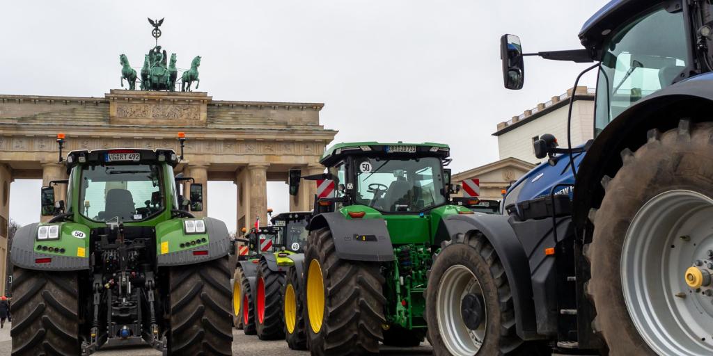 Parade of tractors approaching the Brandenburg Gate