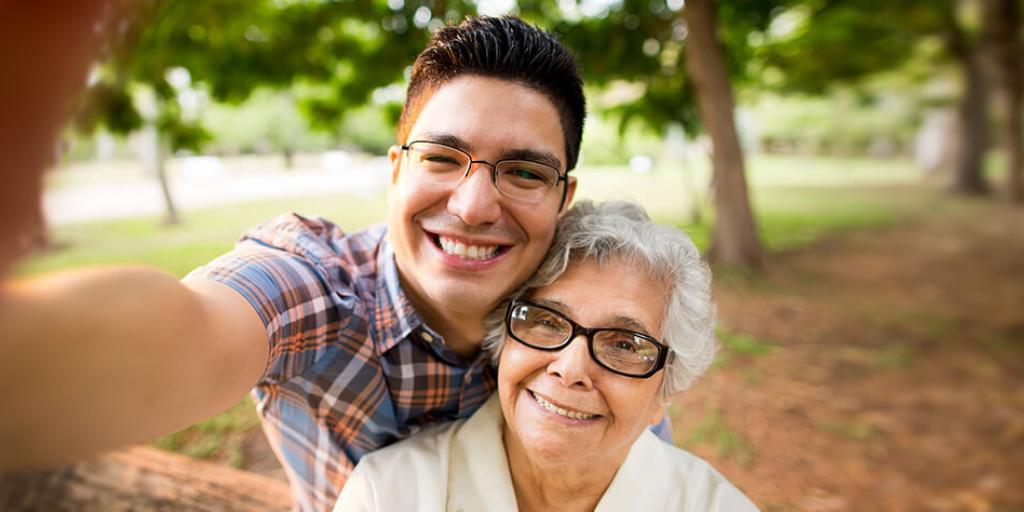 man taking a selfie with "grandma"