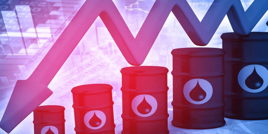 oil barrels and a downward trending arrow