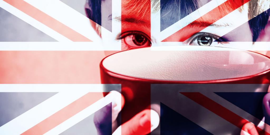 child holding up empty bowl with British flag