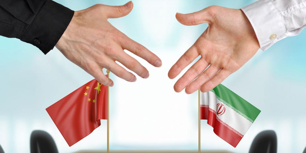 shaking hands and Iran and China flags