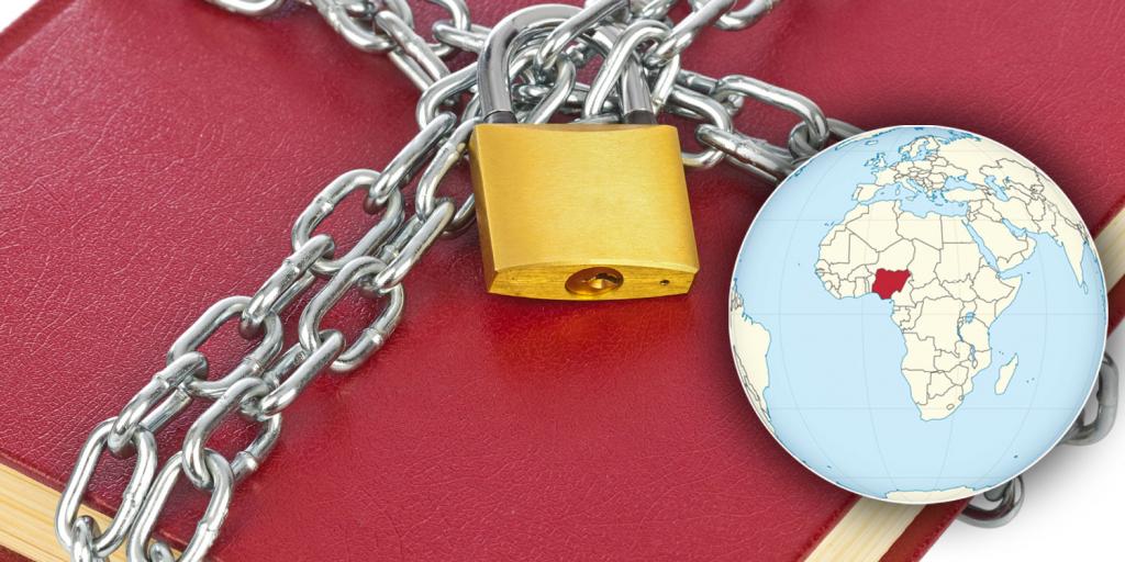 a Bible in chains next to a globe pointing out the country of Nigeria