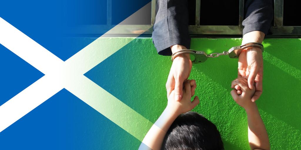 Scottish flag next to an image of a woman reaching through bars with hands cuffed holding hands with a child outside the cell