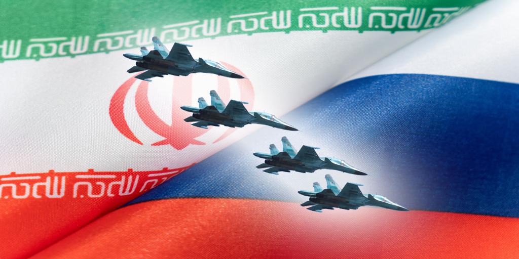 Russian fighter jets against a background of the Russian and Iranian flags