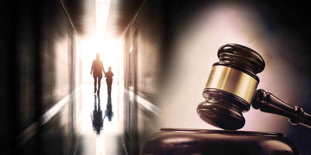 woman with child leaving hallway under gavel