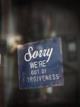 Out of forgiveness sign on window