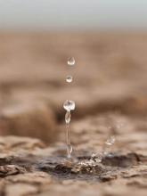 Teardrop or rain on dry dusty ground