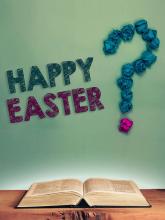 Bible open on table with happy Easter question