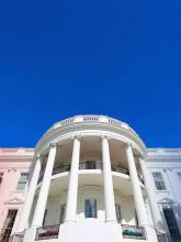 White House with red and blue flowers