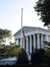 Supreme Court with flag at half mast