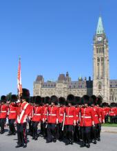Canadian Mounties standing at attention