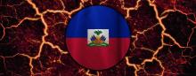 circular representation of Haitian flag against a fiery and cracked background as if it were lava