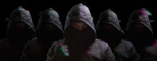 dark image of children wearing hooded sweatshirts
