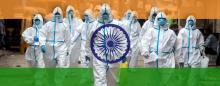 men in hazmant suits with the Indian flag superimposed