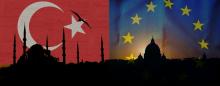 sillhouettes of a mosque and cathedral with islam and eu imagery in the background