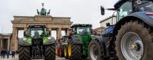 Parade of tractors approaching the Brandenburg Gate