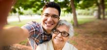 man taking a selfie with "grandma"