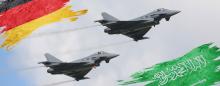 fighter jets flying with German and Saudi flags in the sky