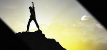 man standing on a mountain top